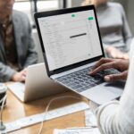 man checking his email laptop 1