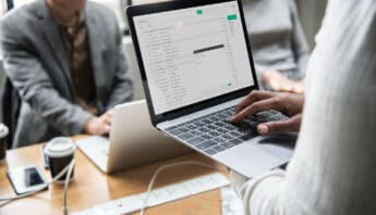 man checking his email laptop